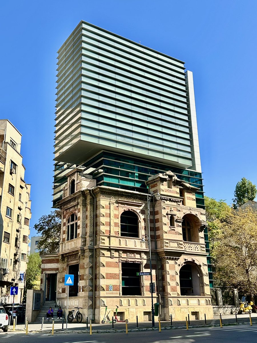 I came across a stunning example of old and new architecture coming together in Bucharest, Romania🇷🇴. 
It’s remarkable how they constructed the new building without affecting the outer structure of the old building beautifully. Seeing this made me a bit emotional .
It’s currently