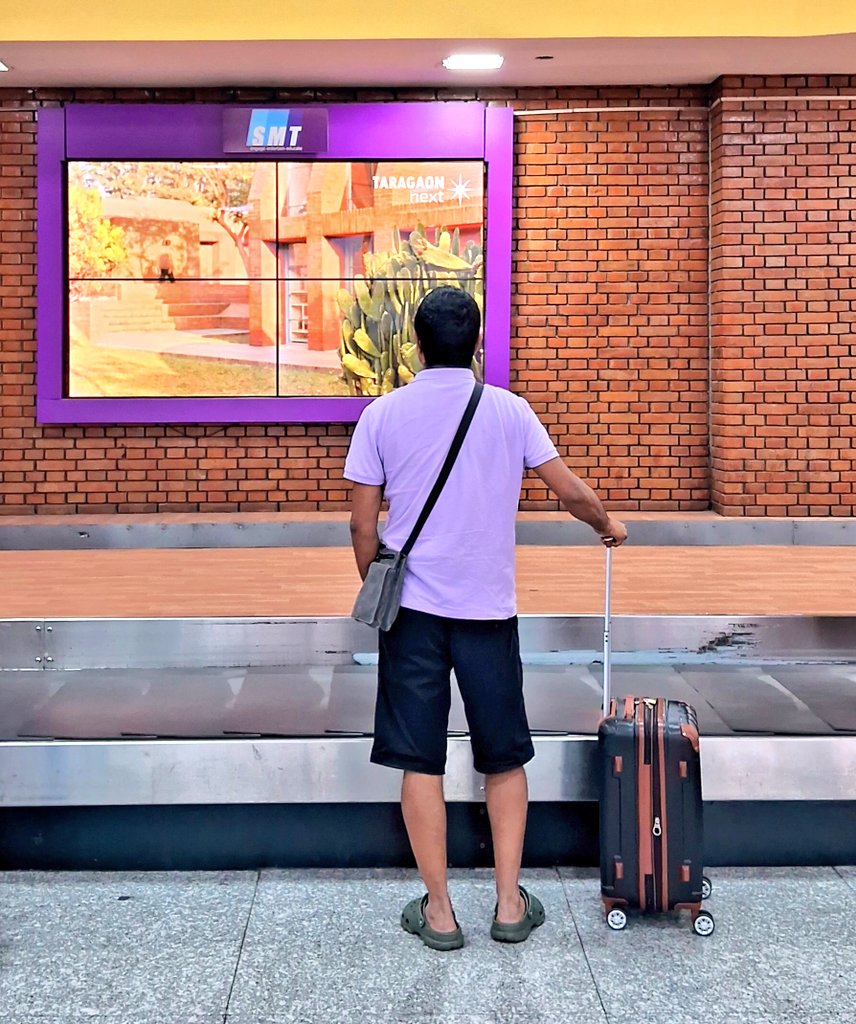 r0shanmishra's tweet photo. Looking at the @TaragaonMuseum video at the Tribhuwan International Airport, baggage collection area. The  video will be displayed on the screen for almost another 18 months.

#tribhuwaninternationalairport
#tia
#taragaonnext
#taragaonmuseum
#mustvisitplace https://t.co/CCMelLeuTE