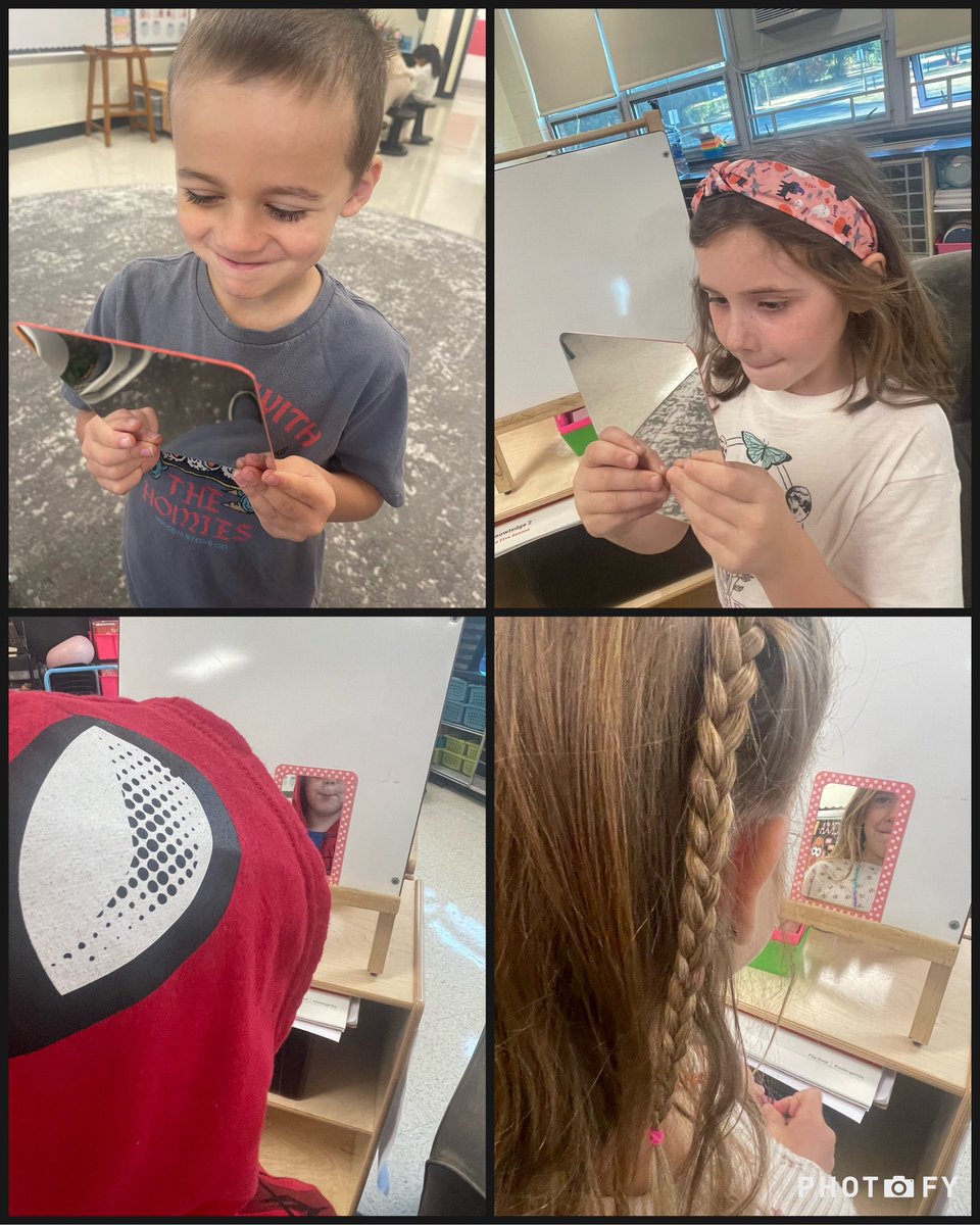 Practicing our first sound in mirrors to see what our mouth looks like when we say “m”!