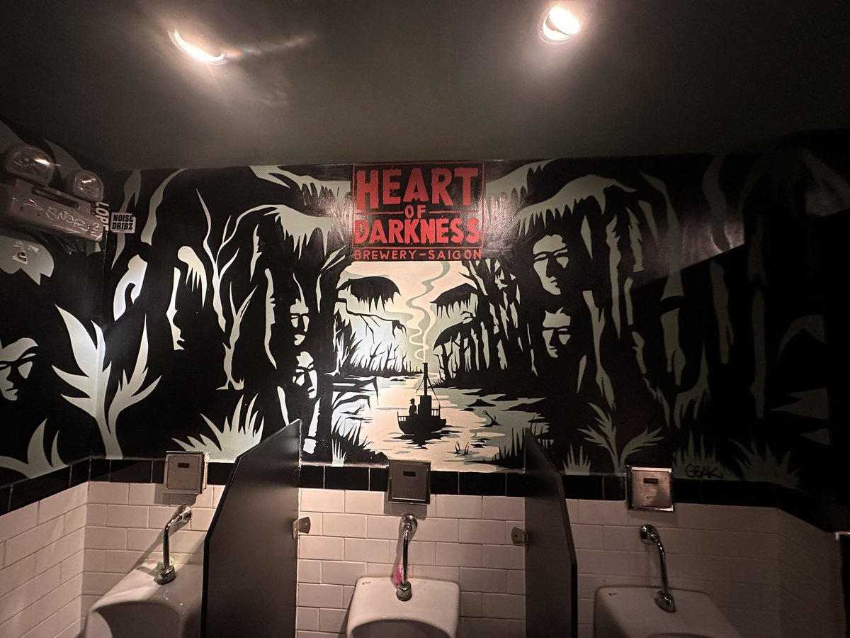 MikeM_75's tweet photo. In Ho Chi Minh City (aka Saigon) and came across this place…named after the book that was adapted into Apocalypse Now.
Didn’t get a picture but was wearing my Hard Core Recondos shirt while sitting at the bar. 
@jockowillink @LeifBabin https://t.co/KWQS1Oaw8f