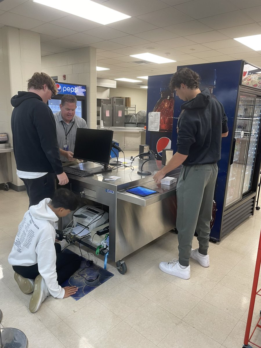 sflynntech's tweet photo. What a great learning experience today for our @RochesterHS_3A Help Desk Students learning how to set up new cafeteria workstations with the assistance of @CTIFiber and our tech specialists! https://t.co/PjK74k6nNa