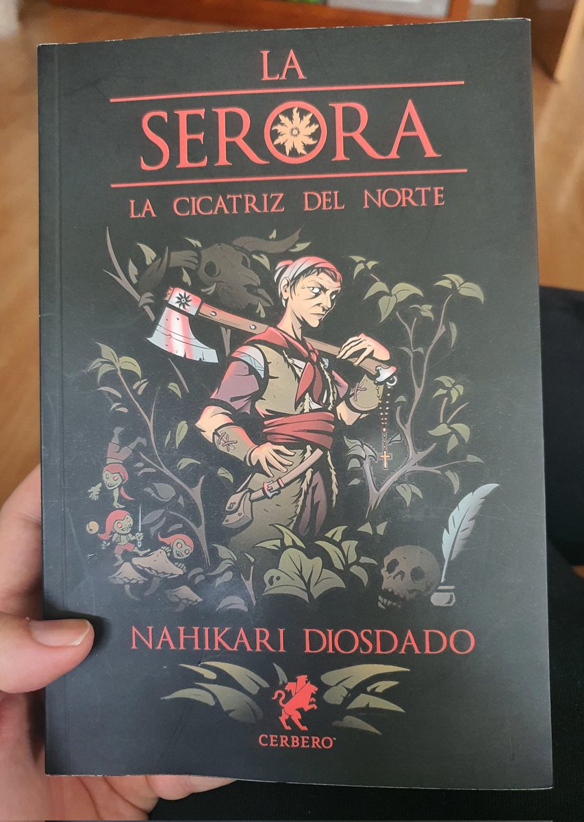 Lectura 284 La Serora. La cicatriz del Norte de Nahikari Diosdado
Fascinante personaje entre sacerdotisa y guerrera que se mueve entre las historias de fantasía como una justiciera y todo se adereza con el folklore vasco de manera ingeniosa y divertida. Otra fantasía posible
4/5