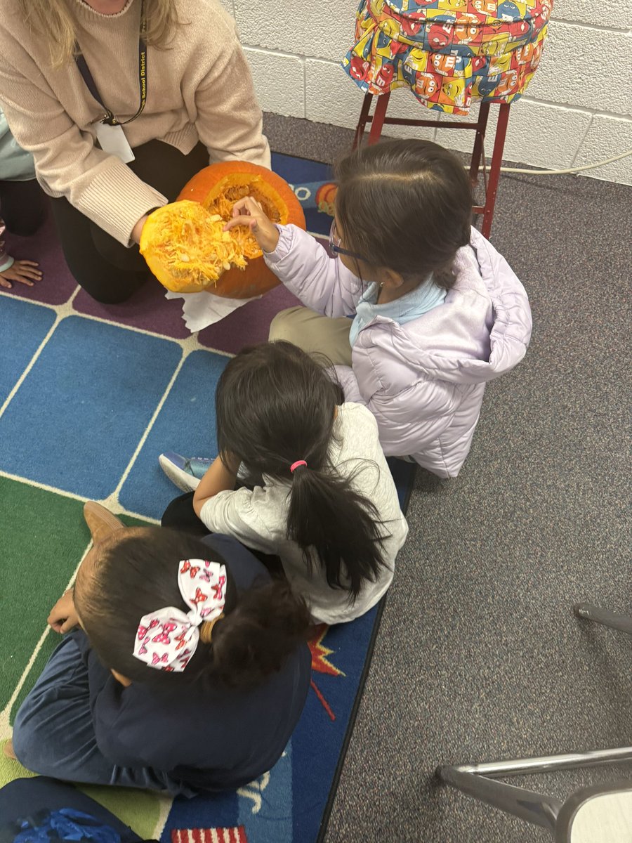 Hands on learning with our ESL teacher, Mrs. Hagan! 🎃 Using adjectives to describe the inside of a pumpkin. #BelieveInFLC
