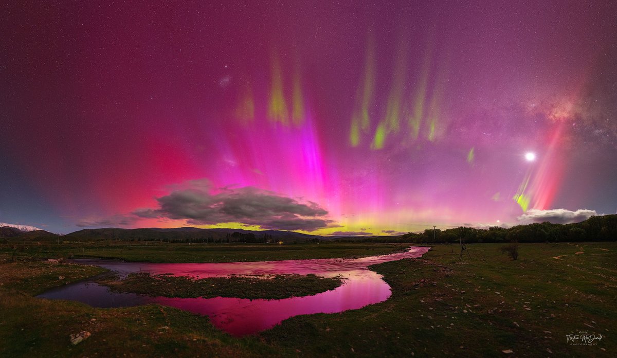 Sometimes the night sky is full of surprises. Take the sky over Lindis Pass, South Island, New Zealand one-night last week. Instead of a typically calm night sky filled with constant stars, a busy and dynamic night sky appeared. Suddenly visible were pervasive red aurora, green