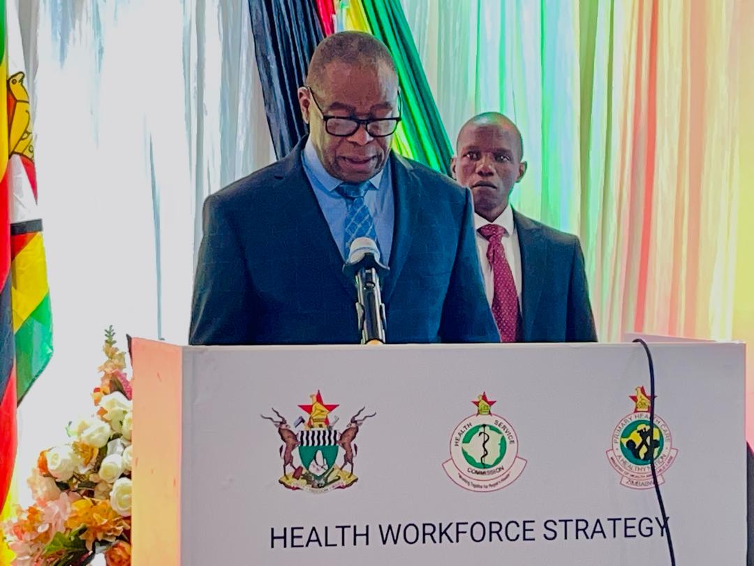 MoHCCZim's tweet photo. @MoHCCZim Hon. Min. Dr. D. T Mombeshora presents his distinguished Keynote Address of the Health Workforce Strategy (2023-2030) and Health Workforce Investment Compact (2024-2026) signing ceremony @InfoMinZW @ZBCNewsonline @WHO_Zimbabwe @UNICEFZIMBABWE @HRFZim @GlobalFund #Health https://t.co/EKFEVyaP4L