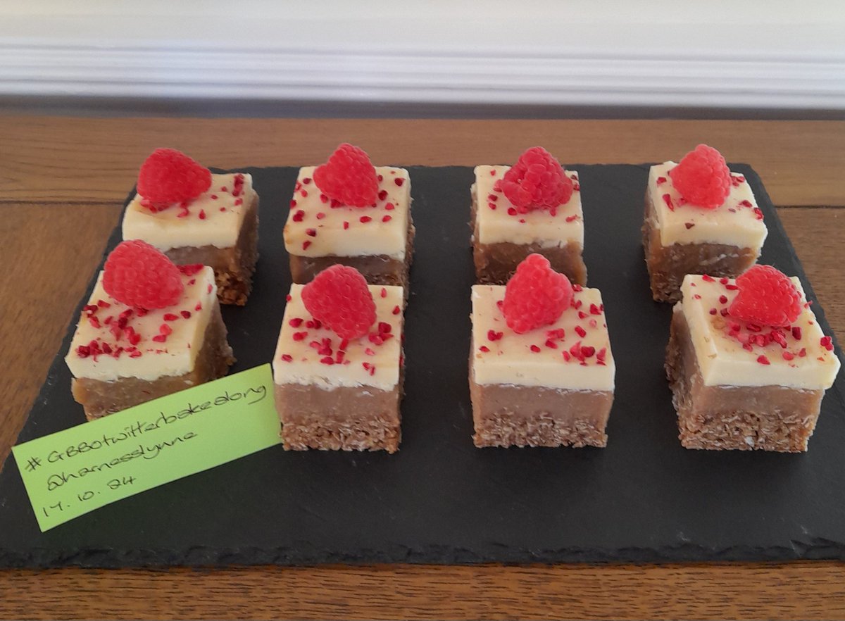 HarnessLynne's tweet photo. Millionaire's Flapjacks for caramel week signature topped with white chocolate ganache, fresh and freeze dried raspberries #GBBOtwitterbakealong @marybethxx6 @thebakingnanna1 @Rob_C_Allen https://t.co/kQW3WReAIT