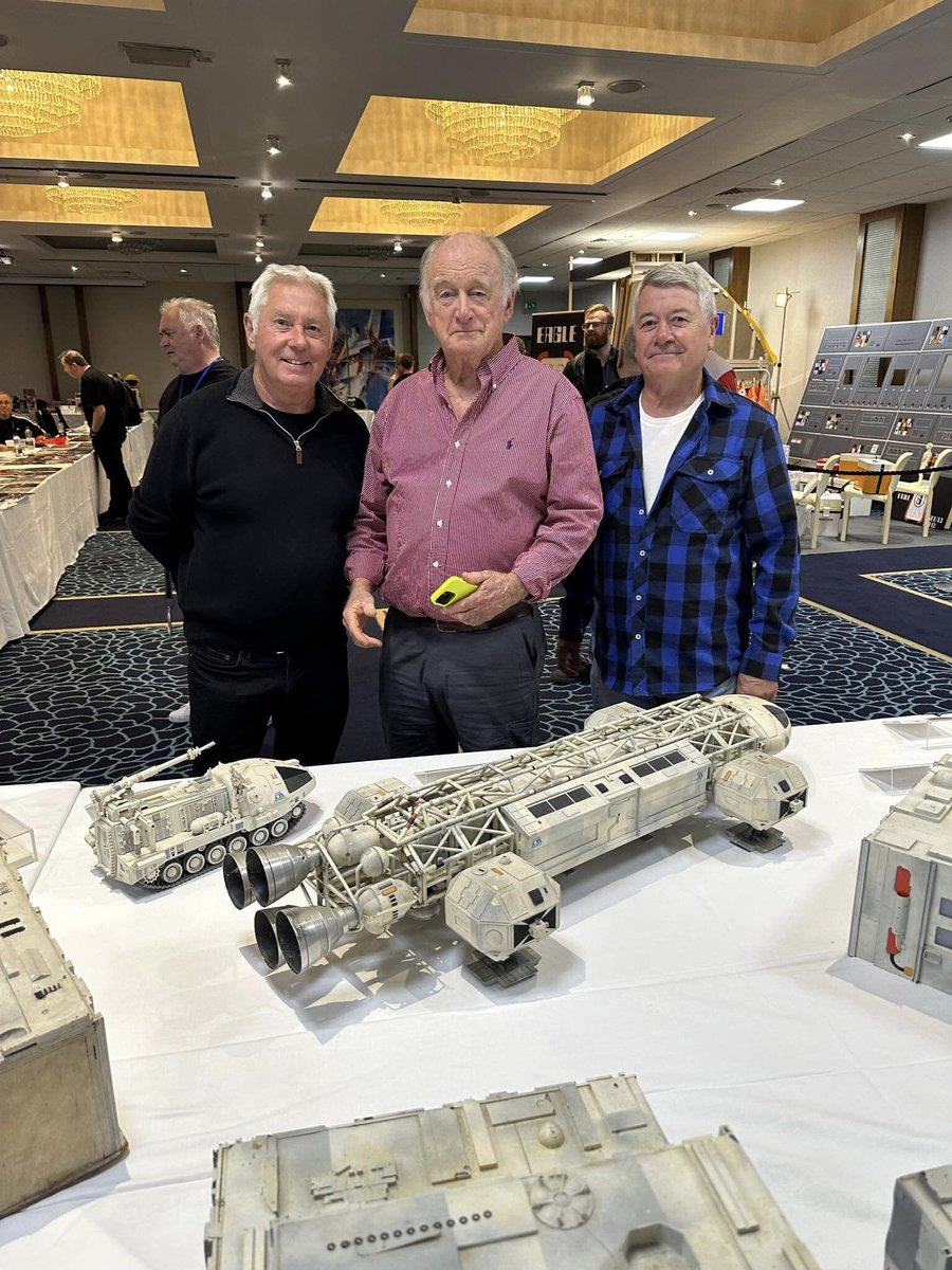 EagleAlpha1999's tweet photo. The original #Eagle Transporter builders #GaryDickens and #DavidSeymour reunited with #Eagle2 at the 50th Anniversary Space 1999 convention - also pictured with actor #NickTate who played Eagle pilot #AlanCarter in #Space1999 https://t.co/O4s9NgfzA5