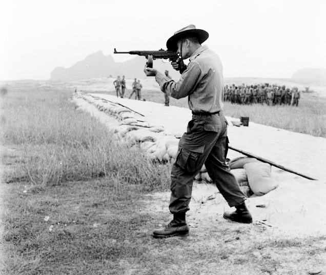 AUSTRALIAN Soldier fires a K50M - a communist weapon that allied troops often faced. This photo shows a drum mag, which is fairly rare.