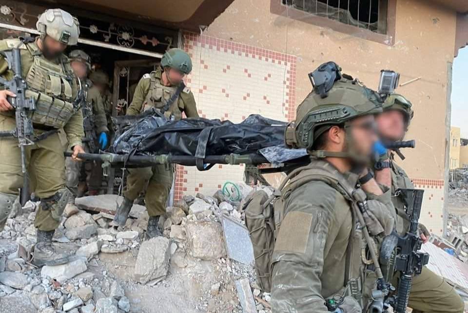 An Image claimed to show the moment that the Body of Yahya Sinwar, the Senior Leader of Hamas, was removed from the Building he was Eliminated in near Rafah in Southern Gaza.