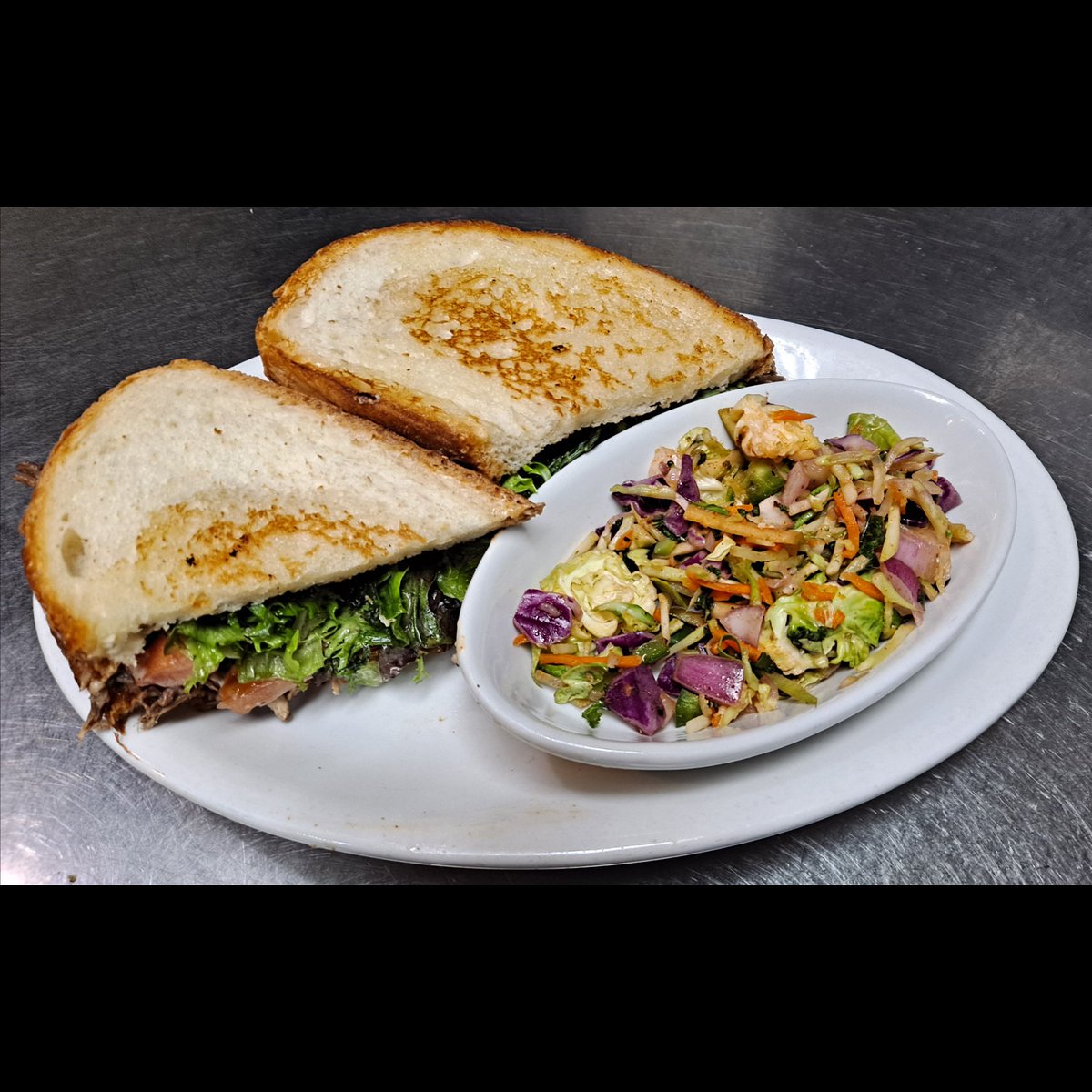 Weekly Food Special - Smoked Beef BLT! Indulge in a sandwich featuring our house-smoked beef, bacon, mixed greens in our Gose vinaigrette, ripe tomatoes on a toasted panini, complemented by our homemade remoulade sauce. #BrewedOnBase