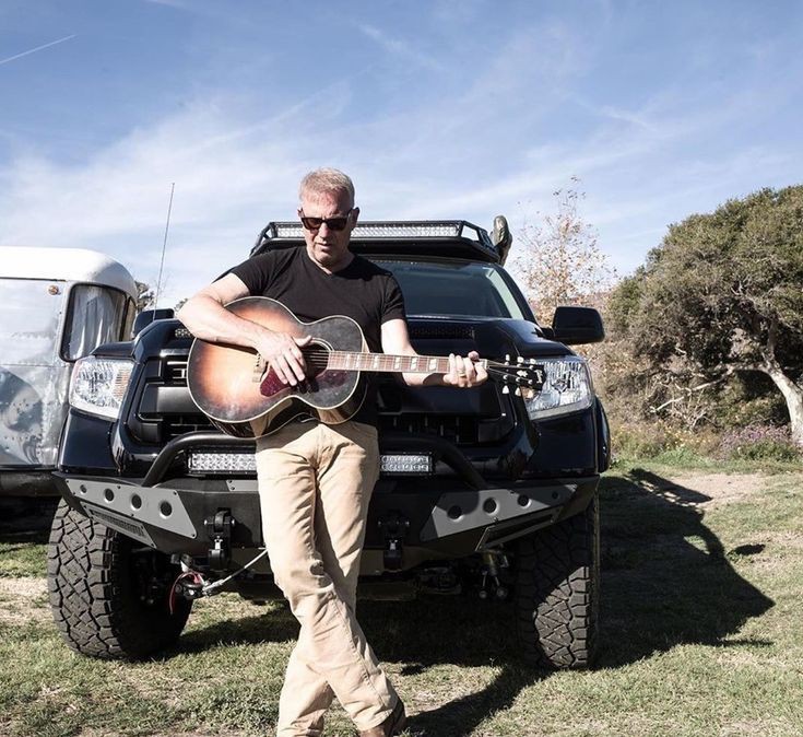 KevinCostner3x's tweet photo. "Finding solace in solitude with my guitar 🎸. Sometimes, all you need is a little time alone to play ⏯️ and let the lyrics speak to your soul. 🎶✨ #MusicTherapy #GuitarVibes" https://t.co/IXJjPFYxPS