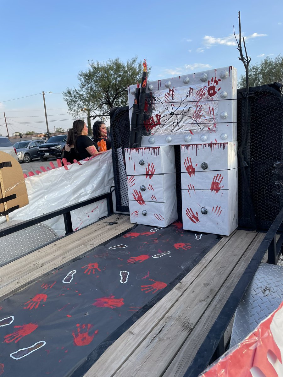 My awesome students working hard for Riverside High School Hall decoration and parade for homecoming 🧡💙