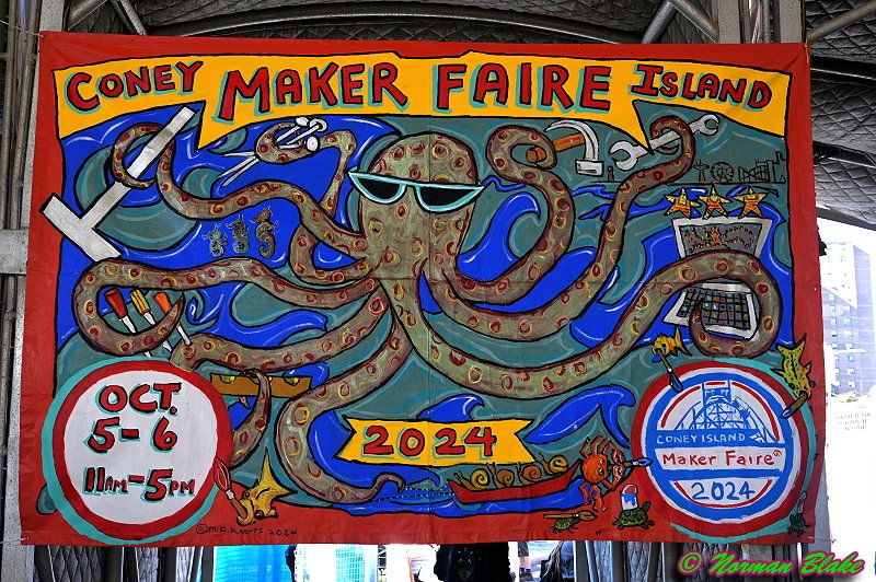 The 2nd Year of Maker Faire Coney Island started with an actual 8'x6' banner by resident Coney Island artist Marie <a href="/bitterwonder/">Marie Roberts</a> Roberts!

"Persons of Altitude" who tried to walk under the center 22nd st entrance: sorry for the neck strain.

This year's theme was "Collaborators."