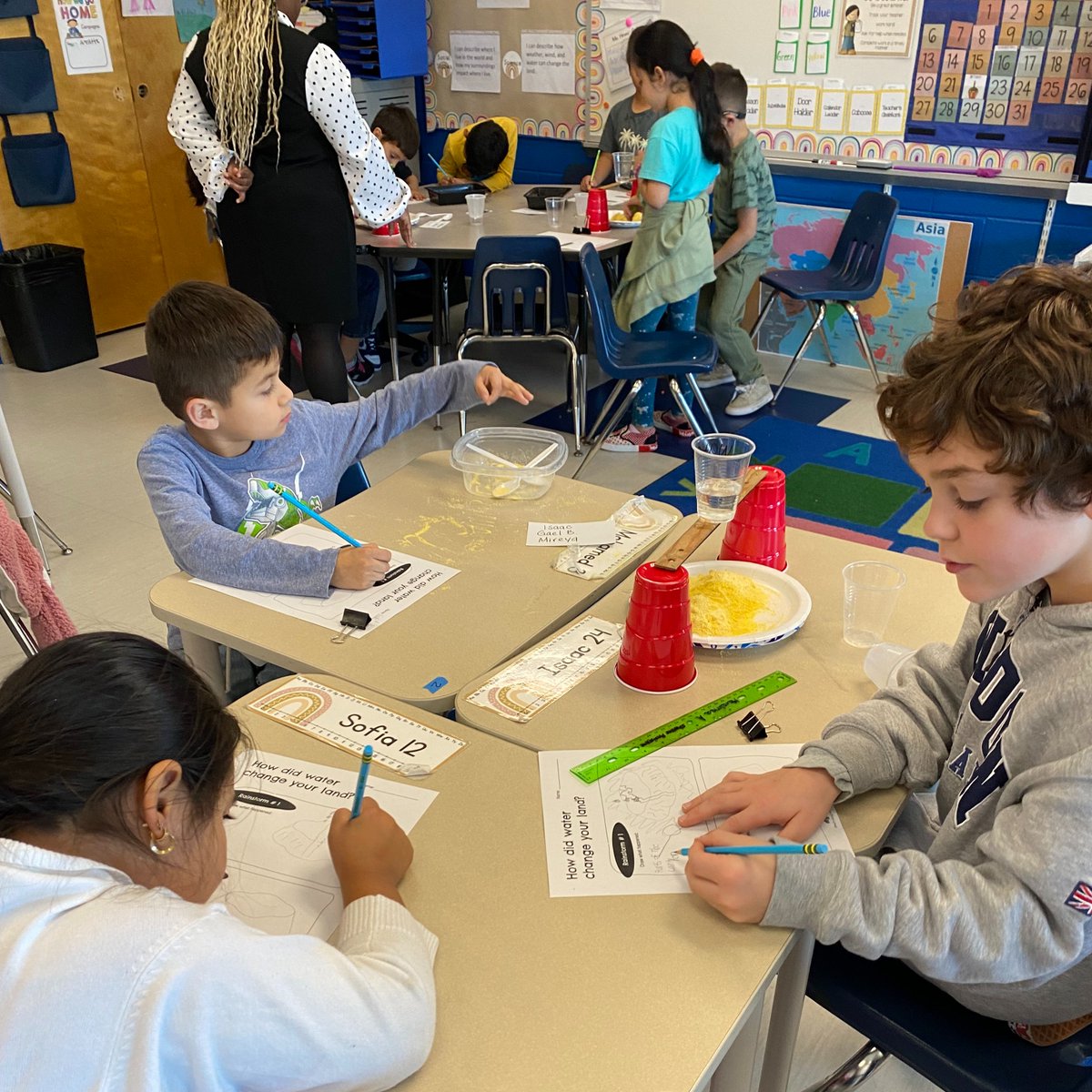 Ms. Davis' second graders are learning about weathering and erosion. They investigated if water is strong enough to make a canyon. They did this by making their own landforms, then adding a rainstorm to observe what happens to the land when the water comes in contact with it.