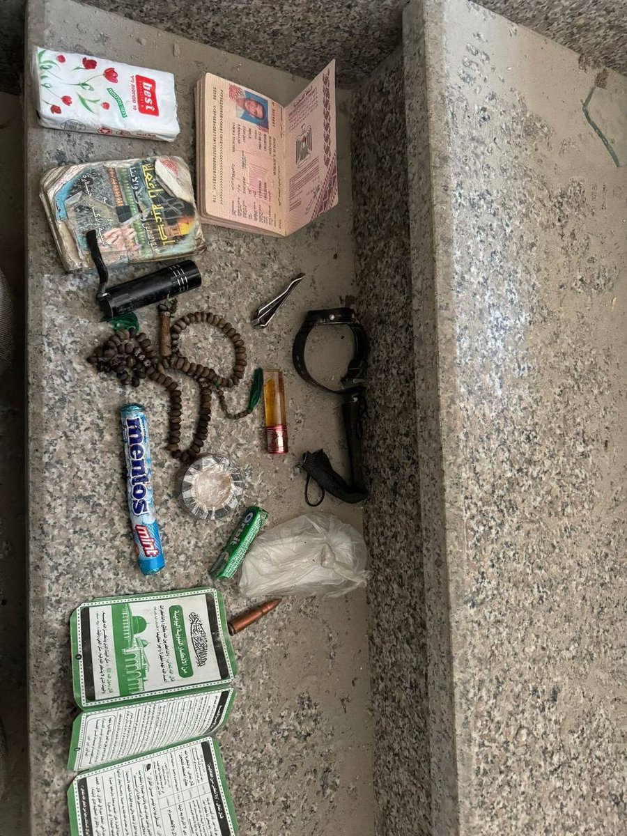 MOSSADil's tweet photo. Some of The items Sinwar carried: 

Mentos, money, a weapon and an UNWRA Teacher ID https://t.co/oYmpZ2ddzo