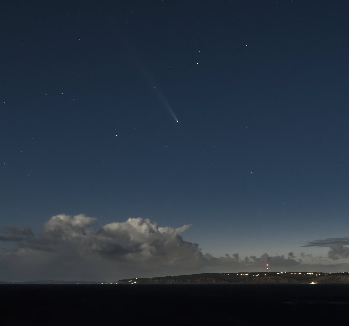 Clouds glowing from a nearly full moon over the southern end of Bell Island, wind gusting to 60 kmh, and Comet Tsuchinshan-ATLAS on its way back to the depths of our solar system for another 80,000 years. Shot from West Point cemetery in Portugal Cove last night. #newfoundland
