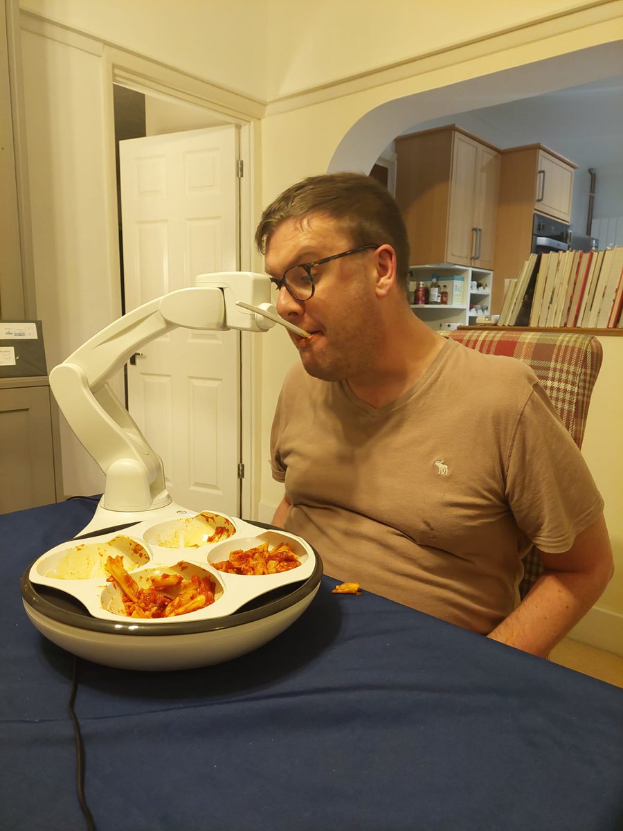 SJHH32's tweet image. For the first time in 2 years, I fed myself dinner! Thanks to modern technology I controlled ‘Obi’ using two foot pedals. MND takes so much, but it won’t take that away from me.