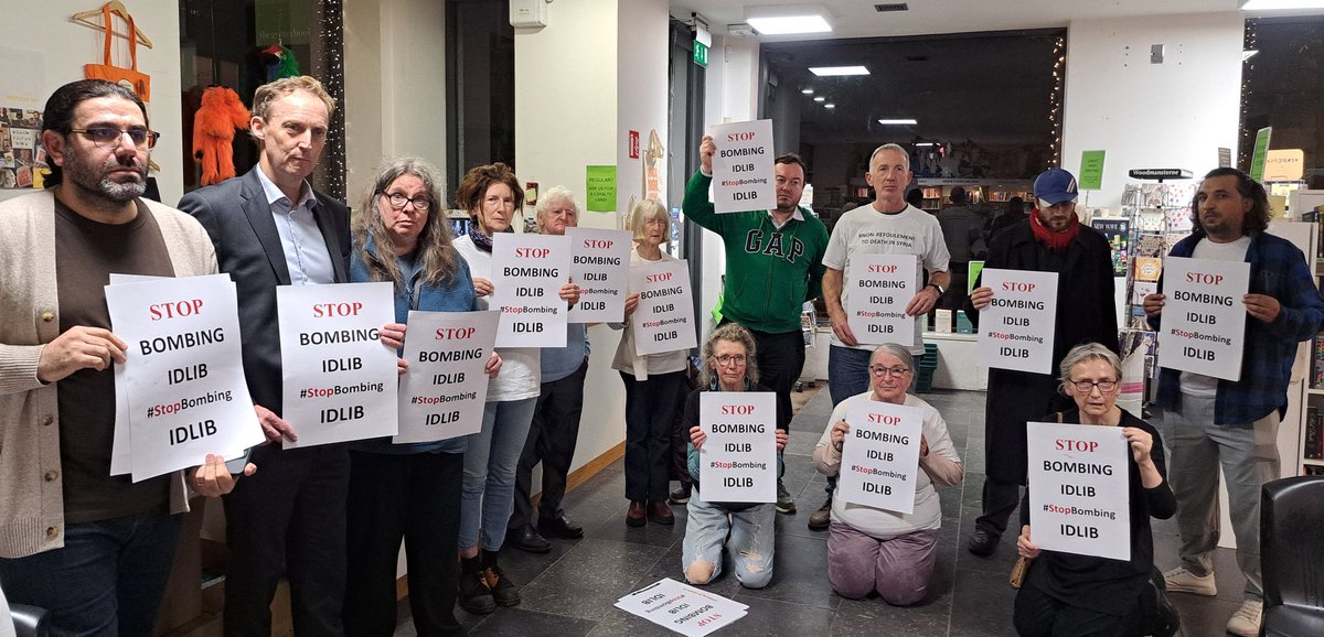 Syria_Irl's tweet photo. At the reading by @JaberBaker1 from his book Syrian Gulag in @gutterbookshop those present stand in Solidarity with #Idlib, where Assad & Russia have escalated their relentless bombing of civilians.
#StopBombingIdlib #EyesOnIdlib #OurFriendsLiveinIdlib #IdlibApocalypse https://t.co/oEYzrjKrwf