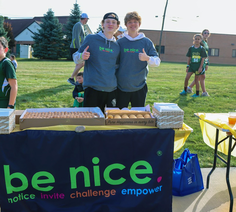 NDPMA's tweet photo. A belated thank you is due to CJ Studt NDP'25 and Nate Seaman NDP'25 from @BeNiceNDP, who were a big help last Saturday at the 2024 Notre Dame Prep Irish Dash 5K Fun Run/Walk! #DoingDonuts #DonutDetail #applecider @benicendp @benice.mi https://t.co/htfKXJRIwU