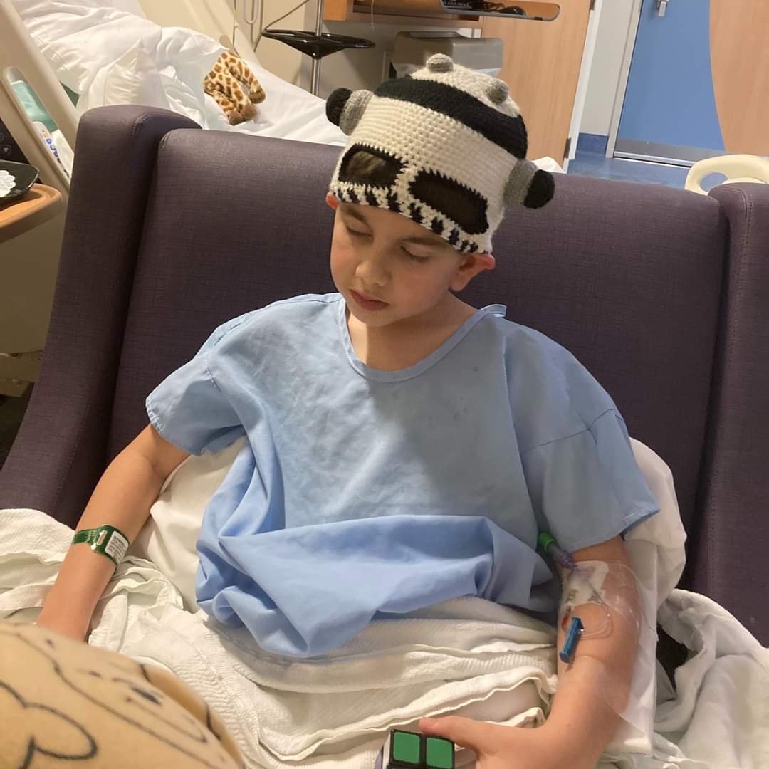 Every hat donated goes to a child in a hospital or cancer center. Here's one of them from last year. Please consider dropping off a new hat to one of our collection partners by November 15. <a href="/MainCareEnergy/">Main-Care Energy</a> <a href="/sunmarkcu/">Sunmark Credit Union</a> <a href="/RecoveryGrill/">RecoverySportsGrill</a> <a href="/raymourflanigan/">Raymour & Flanigan Furniture and Mattresses</a>