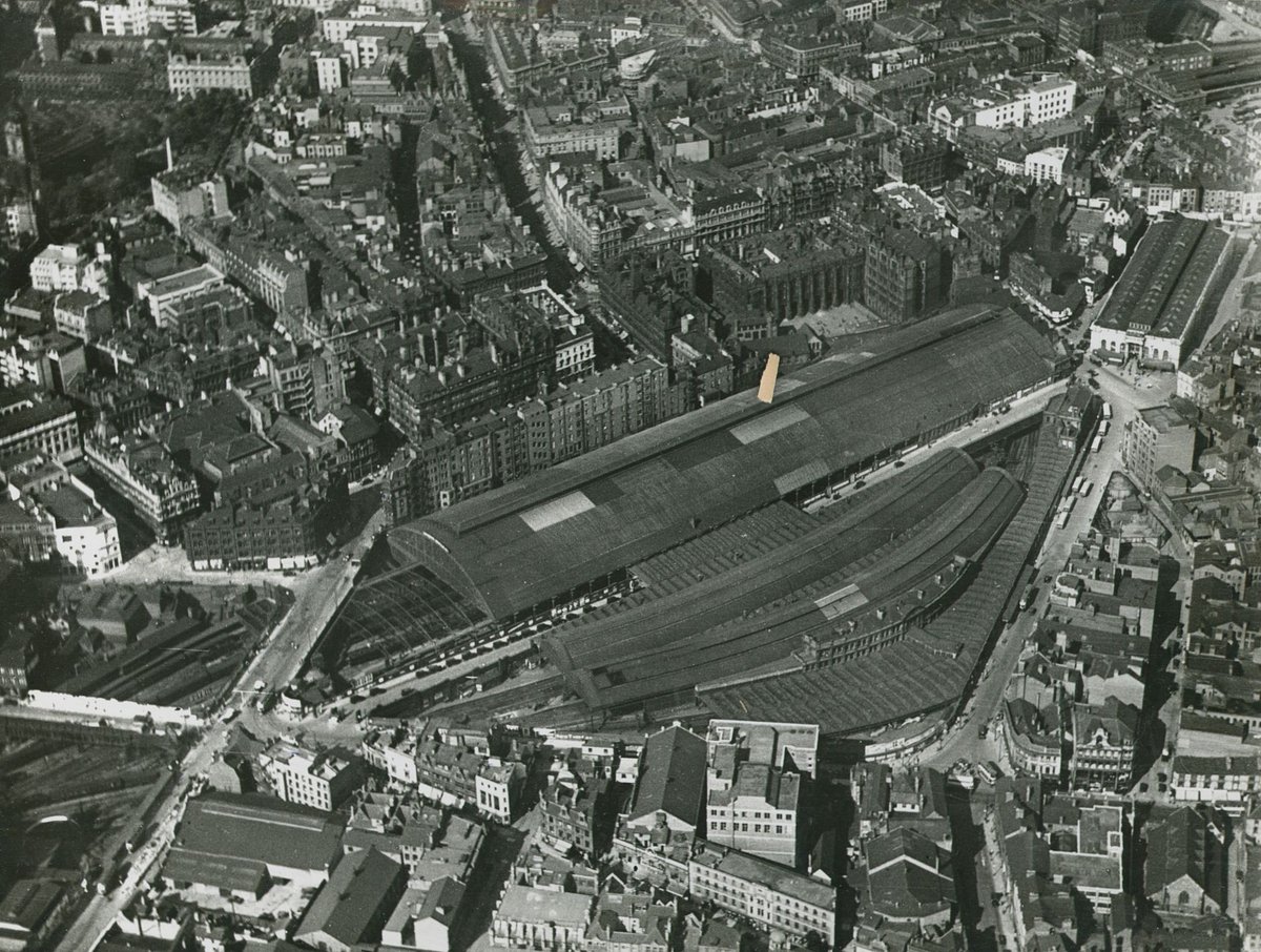#PhotoFriday We believe this aerial photo of New Street Station and surrounding area was taken some time in the 1920s/30s. An impressive expansive shot of the city centre from the market halls across to the cathedral gardens. Ref: New Street Station 41 <a href="/LibraryofBham/">LibraryofBirmingham</a> @Brumpics