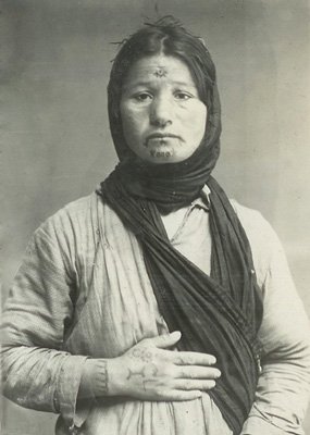 archeohistories's tweet photo. The policy of genocide against the Armenian population of the Ottoman Empire started with the annihilation of the male population and subsequent deportation the rest of the people into the Syrian deserts. These deportations quickly turned into “death marches”. Deportation caravans mostly consisted of old people, women and children. En route many of women were kidnapped either by Ottoman Turkish soldiers or Kurdish bands or Bedouins killing any who tried to oppose them: tens of thousands women and children perished on the way to deserts, while others, in order to escape humiliation and violence, committed suicide.

Armenian genocide resulted in the kidnapping of thousands of Armenian women from their families, usually during deportations or overnight stops. After the organized mass killings of the Armenian male population, during the first stage of state-orchestrated policy of extermination, the Ottoman governors implemented another pre-meditated phase of the genocidal policy: the destruction of the rest of Armenian population in the Ottoman Empire, this time targeting the elderly, women and children.

Some of those individuals who were kidnapped and integrated into Muslim family life, over time forgot about their Armenian ethnicity and even lost the ability to speak their native language. In order to save their own lives and the lives of their loved ones many Armenian women forcibly to adopted Islam. They eventually were married off to Muslim men and in keeping with local tribal customs, were marked with specific tattoos. Tattoos were extensively used as amulets in the Middle East and Islamic countries, with the wearers believing that the mark imbued them with magical powers. These tattoos were often in the form of dots or a small “x” and provided protection, strength or fertility. These new markings represented new belonging and a marked change in their life.

After the end of the First World War, many Armenian organizations and foreign missioners helped rescue Armenian women and children from their captors. These rescue missions turned into large-scale operations, rife with danger. Particularly, Karen Yeppe, a Danish missionary who, with the assistance of some Arab tribe leaders, up until 1928, rescued approximately 2000 Armenian women and children from Muslim captivity. She helped establish special rescue homes in several locations which helped put an end to the tragic and painful ordeal many Armenian women had suffered.

Many volunteers paid dearly with their lives for being involved in these rescue operations and many Armenian women felt victim during their escape attempts.

The kidnapping of Armenian children and women and their subsequent rescue efforts outlines one of most tragic and dramatic episodes of the genocidal policy implemented by Ottoman Turkish government against Armenian population in the beginning of the 20th Century.

📷 : Islamized and tattooed Armenian woman, Karen Yeppe alboom, 1920s, AGMI collection.

#archaeohistories
