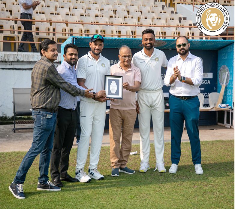 Saurashtra Cricket (@saucricket) on Twitter photo heartily felicitation of <a href="/ShelJackson27/">Sheldon Jackson</a> on his 100th First Class Match. Memento presented by Mr. Niranjan Shah, former Hon. Secretary of BCCI and SCA President Mr. Jaydev Shah, in presence of Mr. Jaydev Unadkat, Mr. Himanshu Shah, Hon. Sec. & Mr. Karan Shah Hon. Joint Sec. of SCA heartily felicitation of <a href="/ShelJackson27/">Sheldon Jackson</a> on his 100th First Class Match. Memento presented by Mr. Niranjan Shah, former Hon. Secretary of BCCI and SCA President Mr. Jaydev Shah, in presence of Mr. Jaydev Unadkat, Mr. Himanshu Shah, Hon. Sec. & Mr. Karan Shah Hon. Joint Sec. of SCA