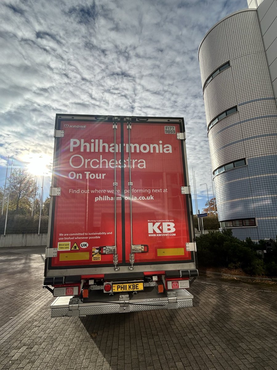 philharmonia's tweet photo. Our brand new truck is on its debut tour, to Tampere in Finland and Tallinn in Estonia.

Whenever possible, it will run on HVO fuel - a cleaner, non-toxic, and biodegradable fuel that reduces CO2 emissions by up to 90% compared to conventional fuel. The team at transport company @kbeventltd worked closely with us to build a bespoke refrigerated trailer, to transport our instruments with both style and care. 

The truck may be Philharmonia red, but we’re on the road to making our tours greener and more sustainable. 

Look out for the truck (pictured here outside Tampere’s Concert Hall with our longtime driver Paul McPherson) out and about around London, Bedford, Leicester, Canterbury and Basingstoke, or indeed all around Europe – and if you spot it, share your pictures with us!