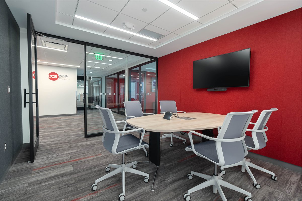 With lots of natural light and many pops of red, this space we recently completed for CAA Health has a bright and energizing atmosphere. #officedesign #officeinteriors