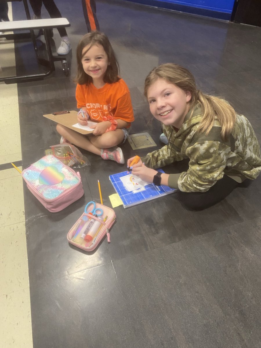 PamerMelissa's tweet photo. Greetings 👋 from the ORANGE house as we work on our COMMUNICATION competency while we describe our pumpkin’s face to be drawn by our partner 🎃⁦@BrunswickCSD⁩ ⁦@MrsBailey_BCS⁩  #BrunswickPRIDE https://t.co/BD5B12Jzd3