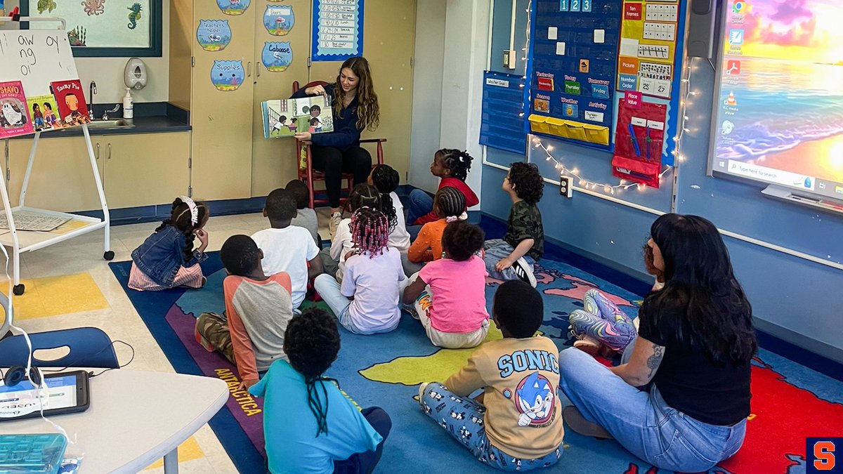 Cuse's tweet photo. Our Community 🍊🧡 

Syracuse student-athletes engage in a reading program with HW Smith Elementary School.

@theACC | #ACCUnityWeek https://t.co/QDlSlUQYxX