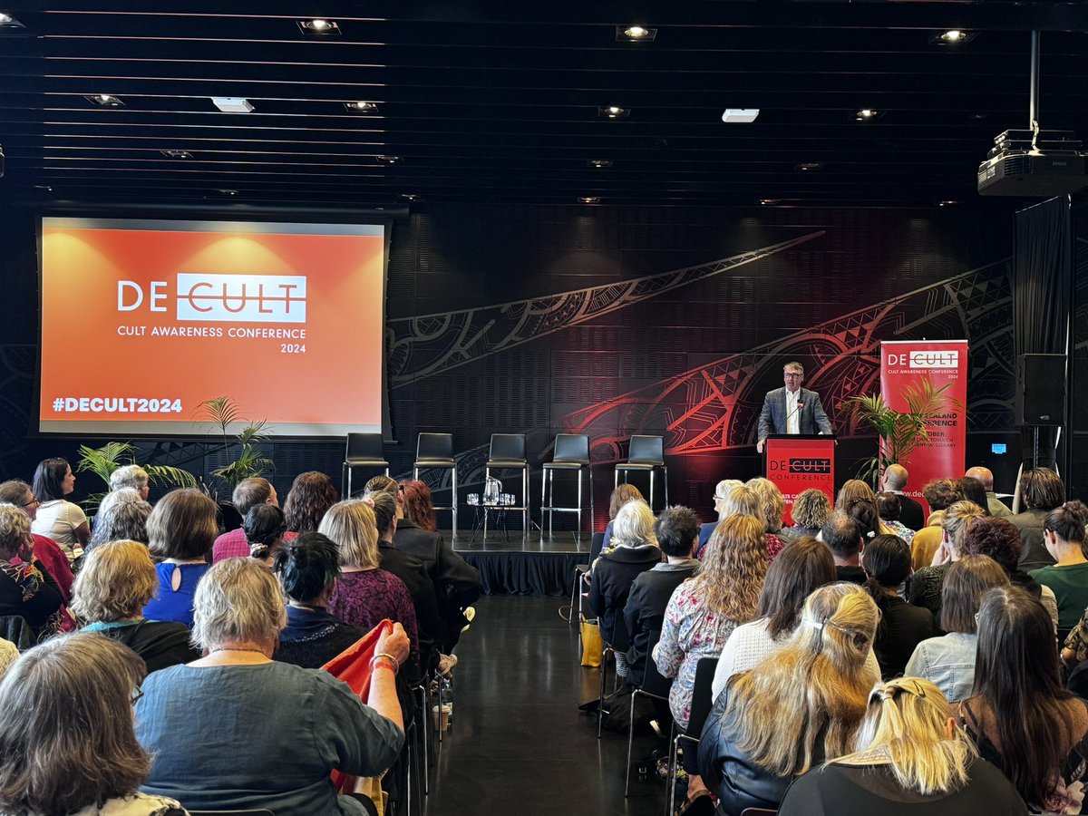 DECULT_NZ's tweet photo. “It’s important to avoid sensationalising or objectifying the experiences of survivors. Victims of cults are real people who deserve to live full and happy lives outside of those coersive groups.” The Hon Dr @Duncan_Webb_ addressing a full audience at the opening of #DECULT2024 https://t.co/7zn7eyVs5G