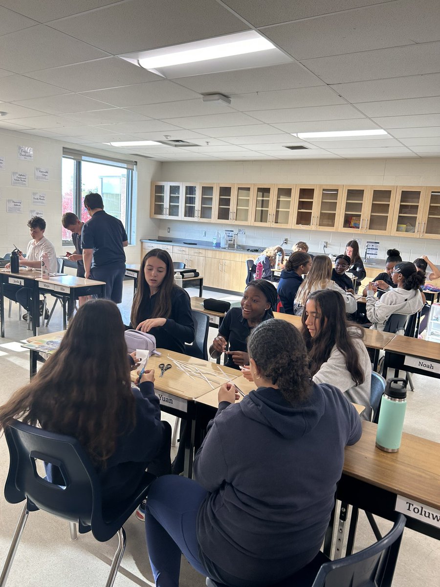 MissVargaa's tweet photo. Today for Fun Friday, the Grade 8s participated in the longest paper chain challenge, using only a single sheet of paper, scissors, and a strip of tape. @StNicholasHCDSB https://t.co/prvrCjv2h3