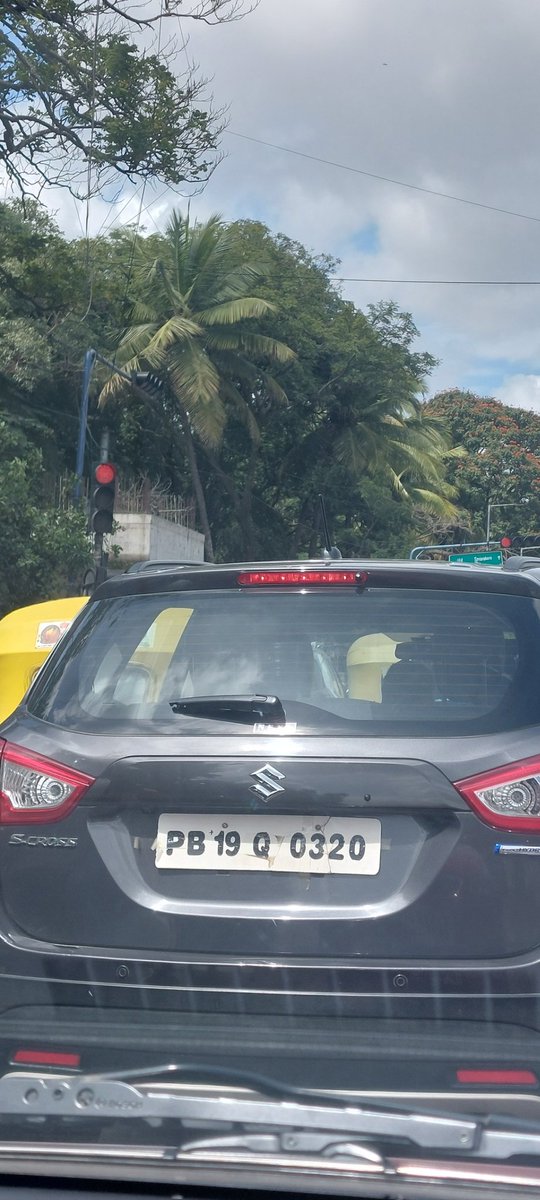 Vikato12's tweet photo. Is dis number plate even allowed to exist? It's in Bangalore. Risk on road. Number plate seems hands written and attached with cello tape @BlrCityPolice. Spotted at kormangla today around 11.00 am new st John medical college signal  @Jointcptraffic https://t.co/sCTFrZOsEL