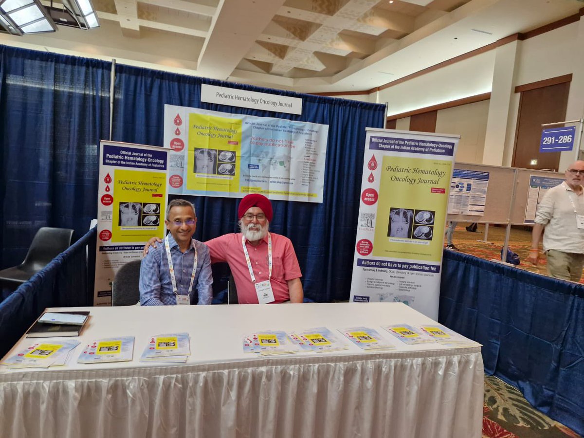 Current and future editor-in-chief of PHOJ at the journal's stall at SIOP, Honolulu