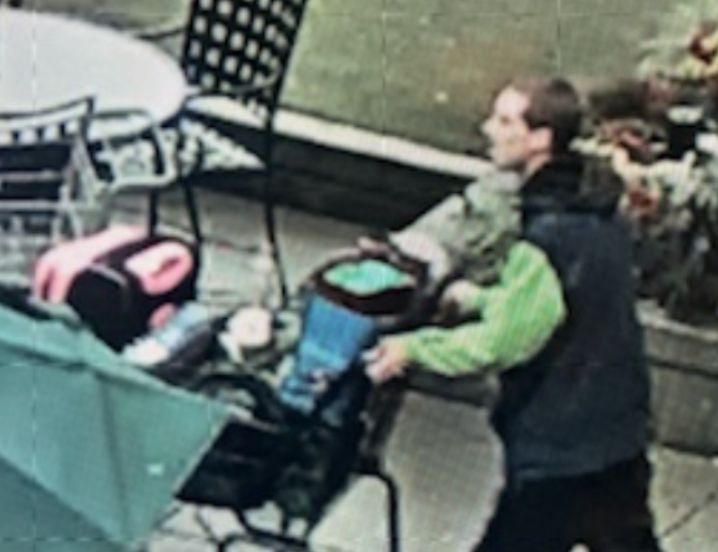 Surveillance video showing Danny pushing a shopping cart outside University Village shopping mall in Seattle.  Look what he's wearing.