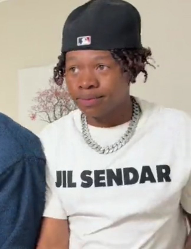 Musa_Khawula's tweet image. Ghost Hlubi wears a fake Jil Sander t-shirt that's misprinted.