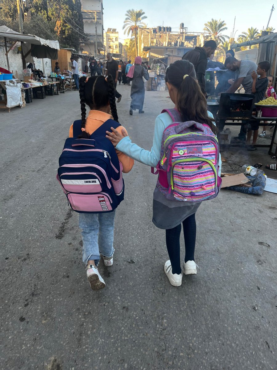 MahaGaza's tweet image. Those carefully styled ponytails and braids, the dark blue tights beneath your cotton dress, the seemingly new schoolbags, and the hair ties perfectly matching your outfit.. Who would guess you've been living in a tent for over a year? Who would imagine last night was another…