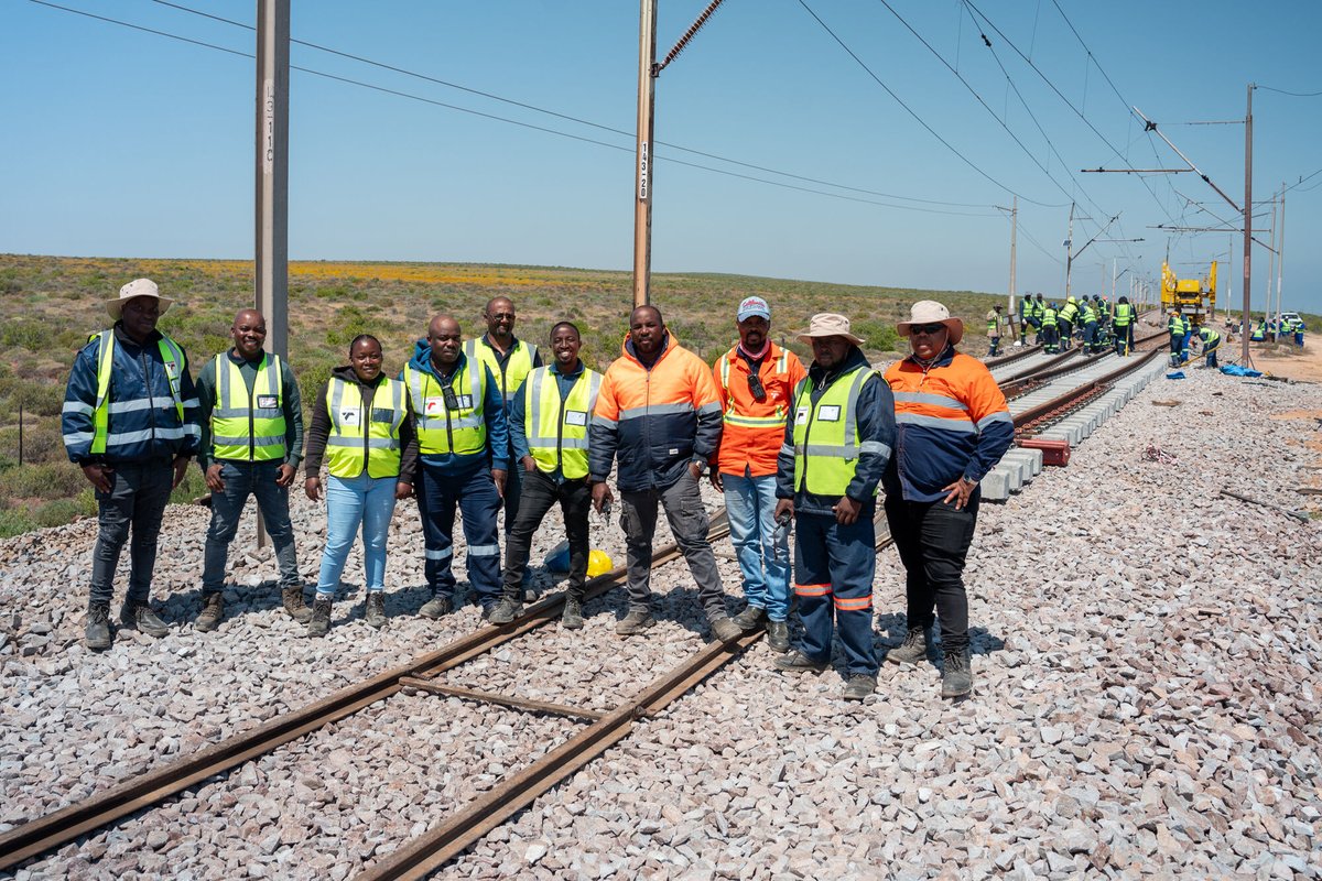 RailwaysAfrica's tweet photo. #picoftheday

Loop 3 - 143km from Saldhana a 1:20 turnout is being installed. This 1:20 turnout, manufactured by voestalpine Railway Systems - VAE SA, is first assembled next to the track. Once the previous turnout has been removed a GEISMAR PEMLEM is used to place the turnout, consisting of two panels, in-track. New ballast, tamping and welding of rail follows.

#transnet #rail #railway #railwaymaintenance #track #railwaytrack