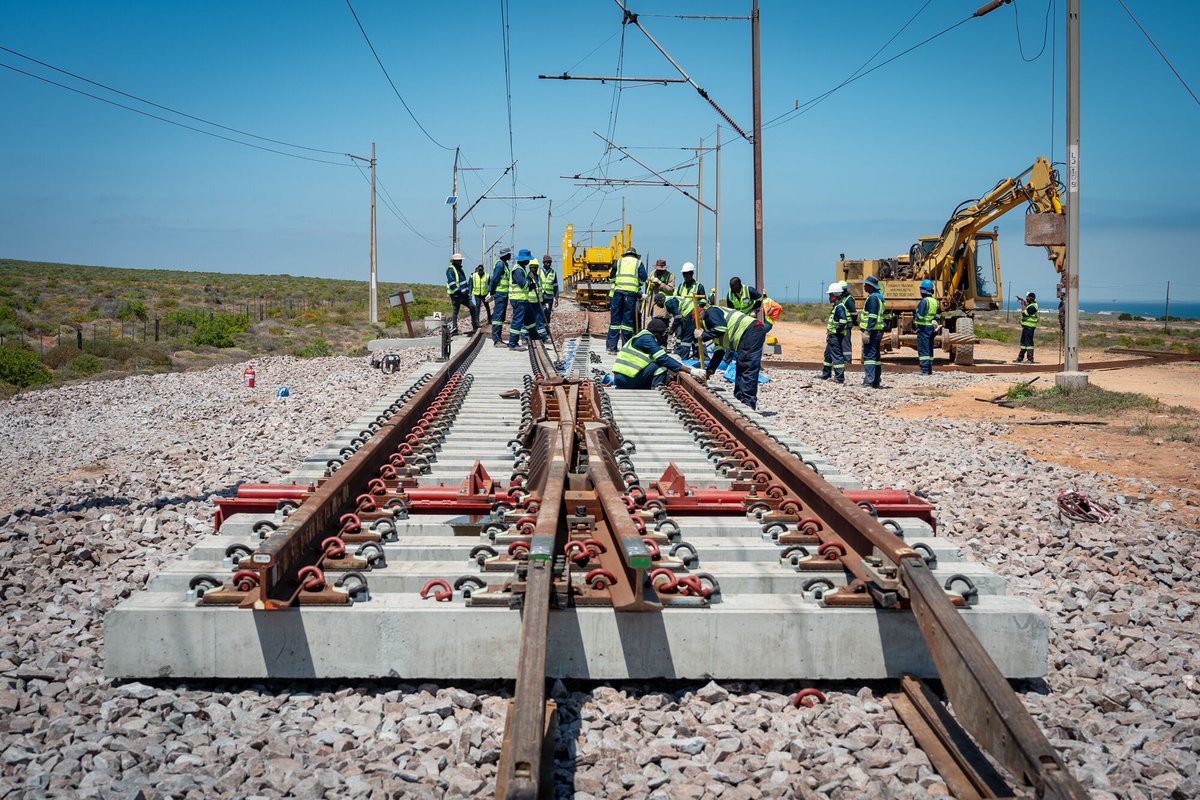 RailwaysAfrica's tweet photo. #picoftheday

Loop 3 - 143km from Saldhana a 1:20 turnout is being installed. This 1:20 turnout, manufactured by voestalpine Railway Systems - VAE SA, is first assembled next to the track. Once the previous turnout has been removed a GEISMAR PEMLEM is used to place the turnout, consisting of two panels, in-track. New ballast, tamping and welding of rail follows.

#transnet #rail #railway #railwaymaintenance #track #railwaytrack