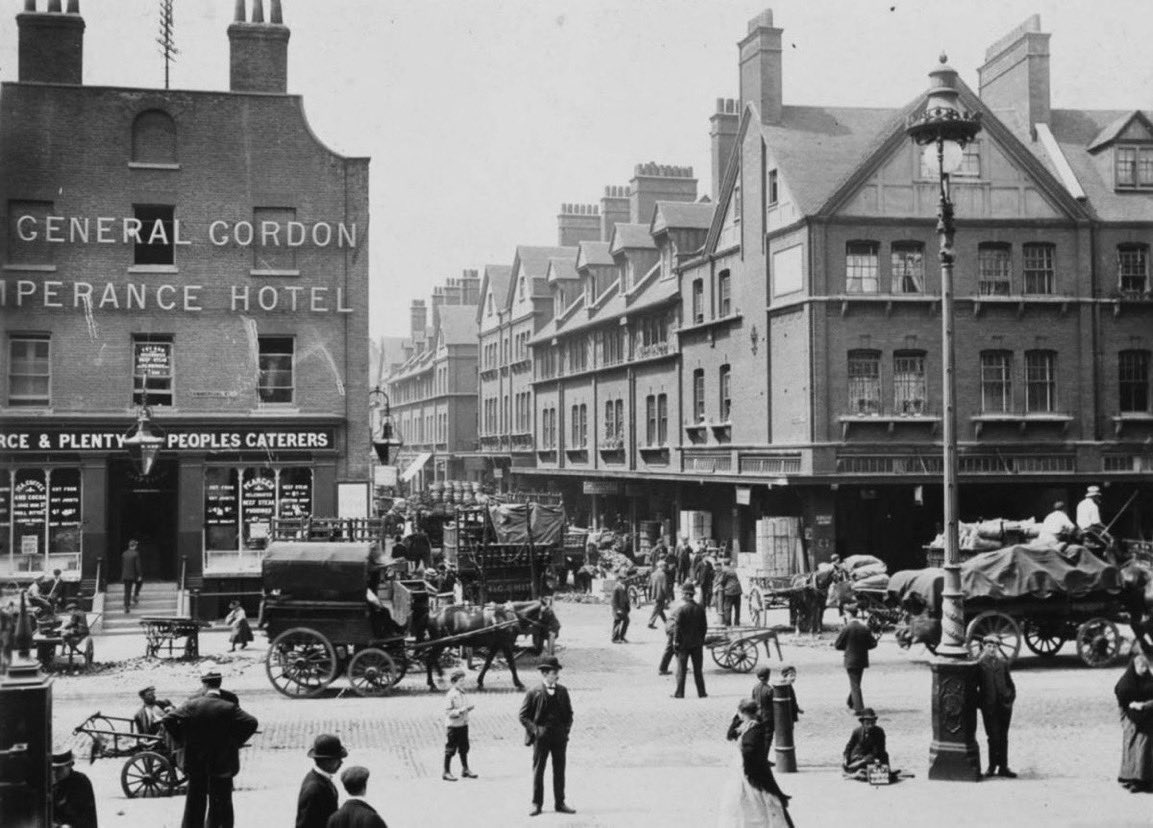 The_East_End's tweet photo. A view of Spitalfield Market (on the right), opposite the General Gordon Temperance Hotel on the corner of Brushfield Street and Commercial Street. Read more of the origin of Spitalfields Market here… https://t.co/FC9RzaMGNe… #eastend #History #london https://t.co/VbFbhWHV13