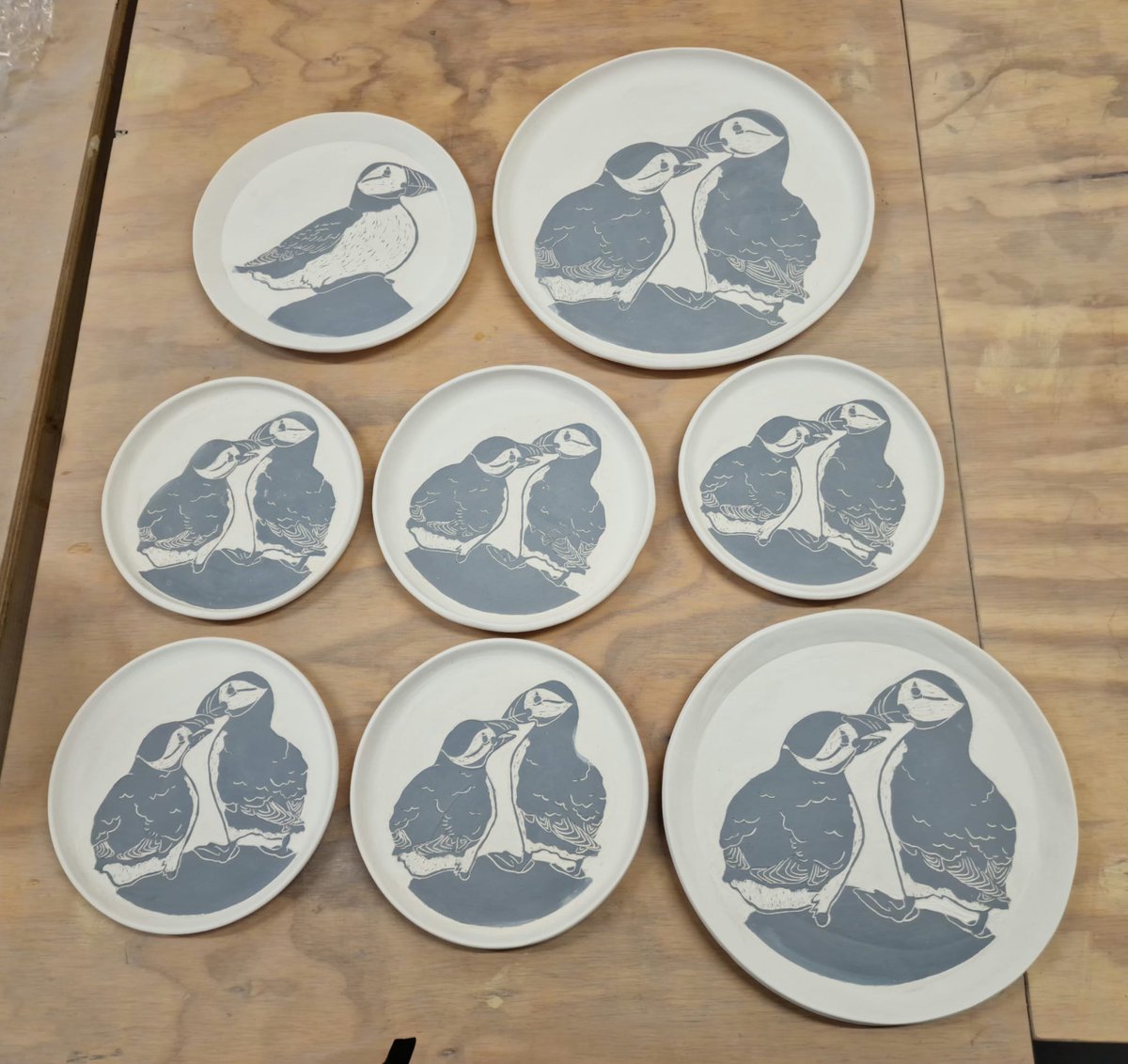 Preparing a load more of Puffin plates for glazing and firing 🐧