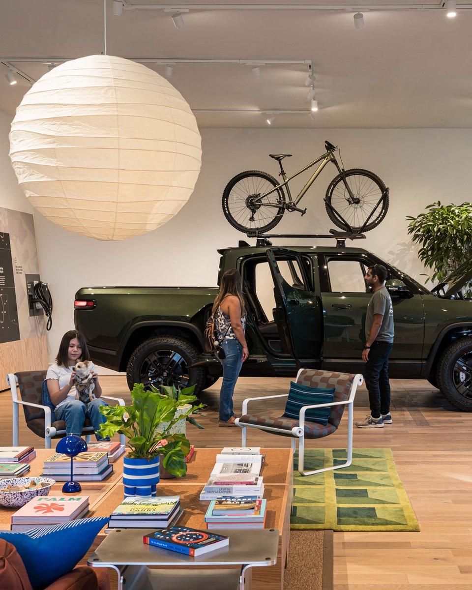 Rivian's tweet photo. We're here, Grand Canyon State! 🌵☀️

We’re thrilled to open our first space in Arizona. Join us October 25-27 in Scottsdale for our grand opening weekend. Sign up for family-friendly events and R1 demo drives: https://t.co/W0adPRkzxS https://t.co/jkyOb5Kyd2