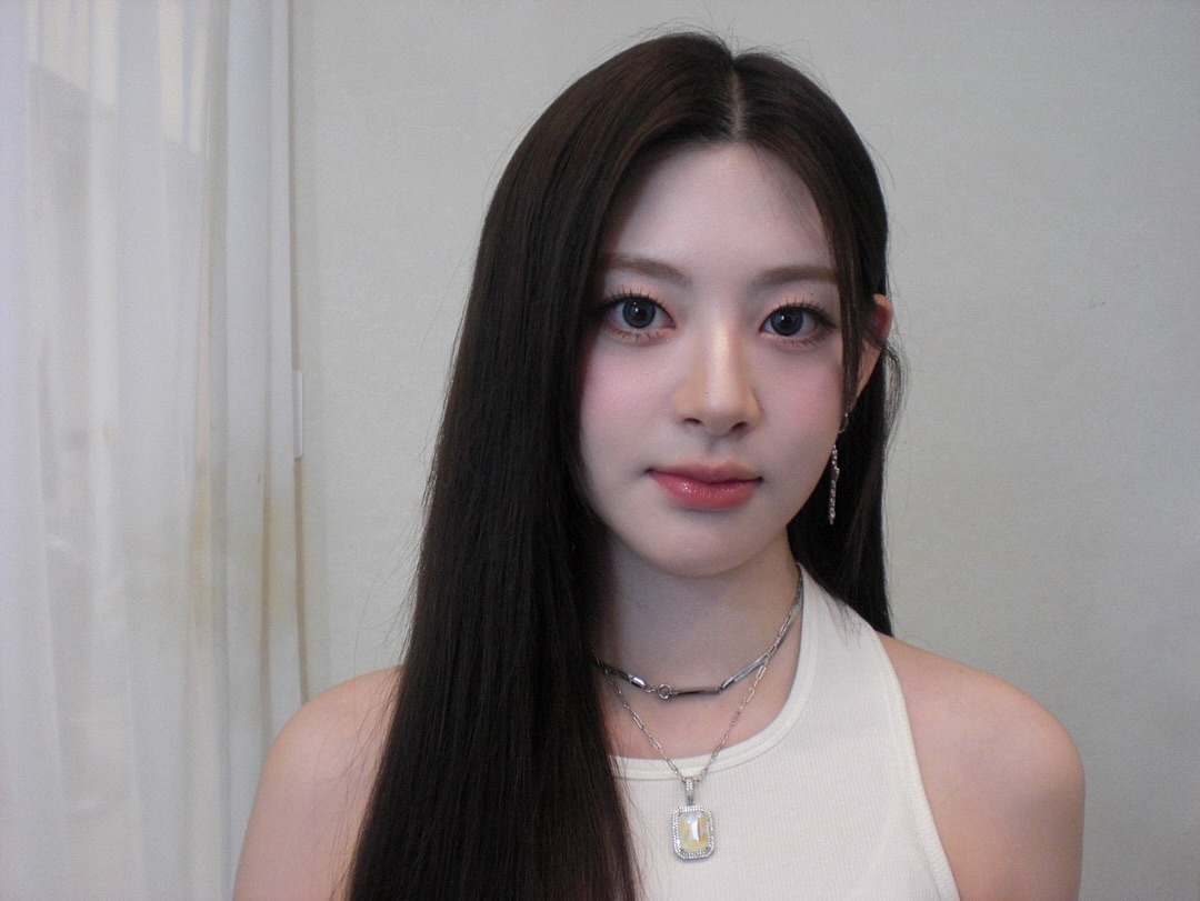 with a serene yet confident expression, this photo captures elegance in its purest form. the soft lighting highlights every delicate feature, creating a timeless feel. the quiet strength in the gaze makes the moment captivating and full of grace.