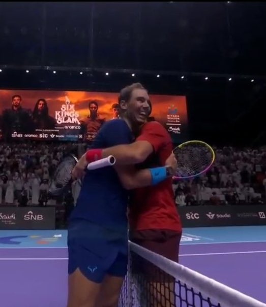 TheTennisLetter's tweet photo. Rafa Nadal and Novak Djokovic share a long hug at the net for a final time. 

This hug depicts a million things at once. 

Joy. 

Pain. 

Utmost respect. 🥹

🐐🐐 https://t.co/UQOjX4U1mG