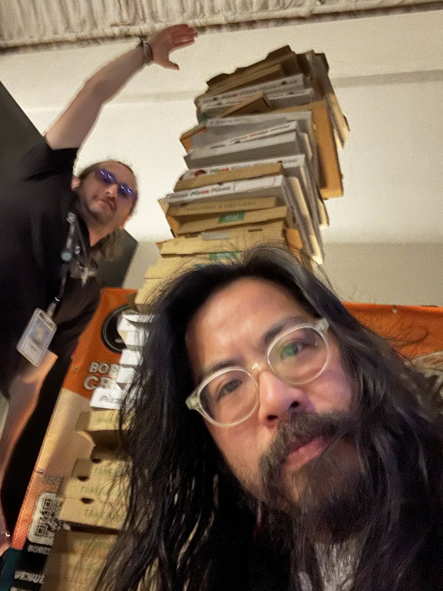 beijingdou's tweet photo. Found the leaning tower of @Pizza_DAO with @SquiddyNFT at @BoredInApe creator house. 🍕🍕🍕 https://t.co/j9u5ynxWVL