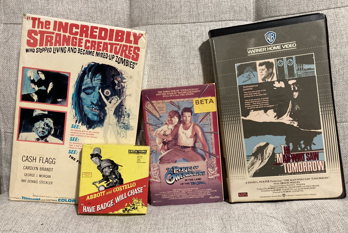 I bought these four movies at an antique store today, none of which are in formats I can actually play. If you know why the hell I felt the need to own them anyway, clue me in.