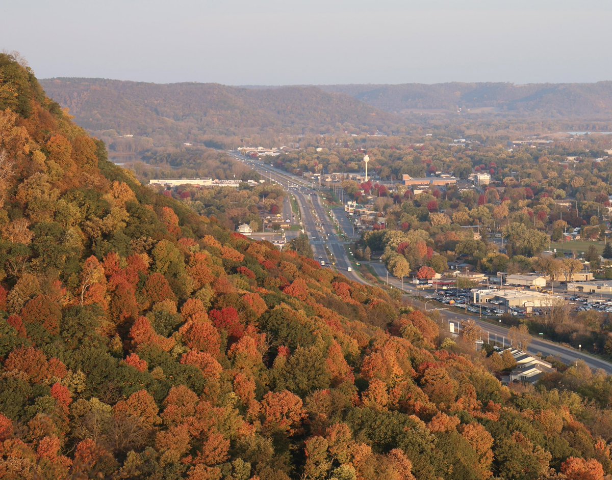Fall colors glow at sunrise this morning, as seen from the bluffs looking north along Highway 61 in Winona