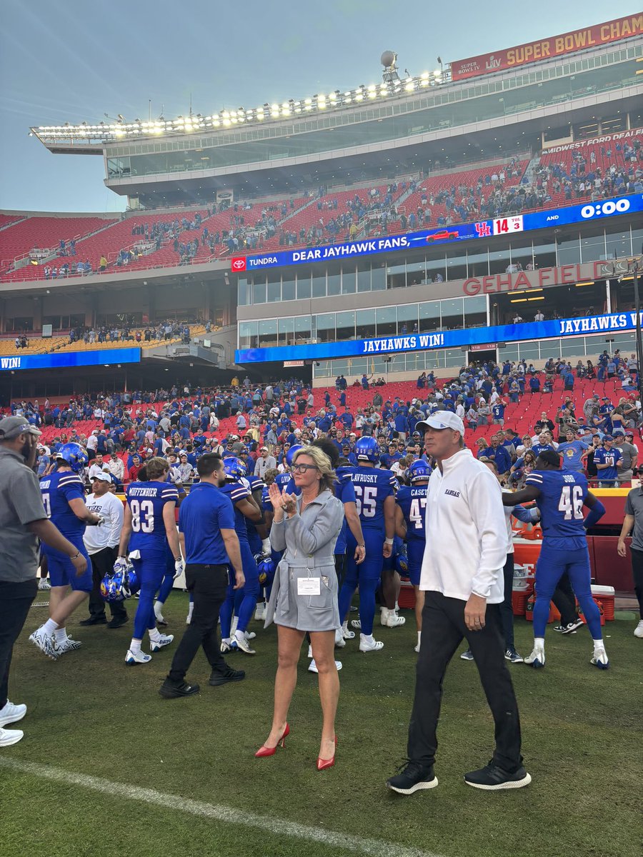 caroline_soro's tweet photo. Lance + Kelly Leipold celebrating with players after the W 

@KU_Football beats Houston 42-14 https://t.co/icPsOYqL1m