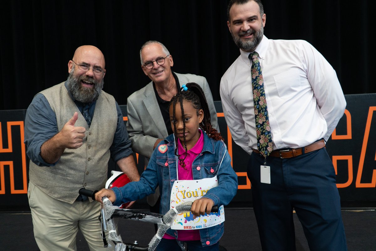 On Tuesday, third graders piled into NHHS's Brogden Hall for the Bikes for Kids Award Ceremony.  The students thought they were there to highlight 5 essay winners &amp; award them with bikes... but SURPRISE! 450 bikes were given away! Thanks to our sponsors &amp; everyone involved!